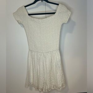 Hollister cream romper with a stretchy top and lace bottoms Size M